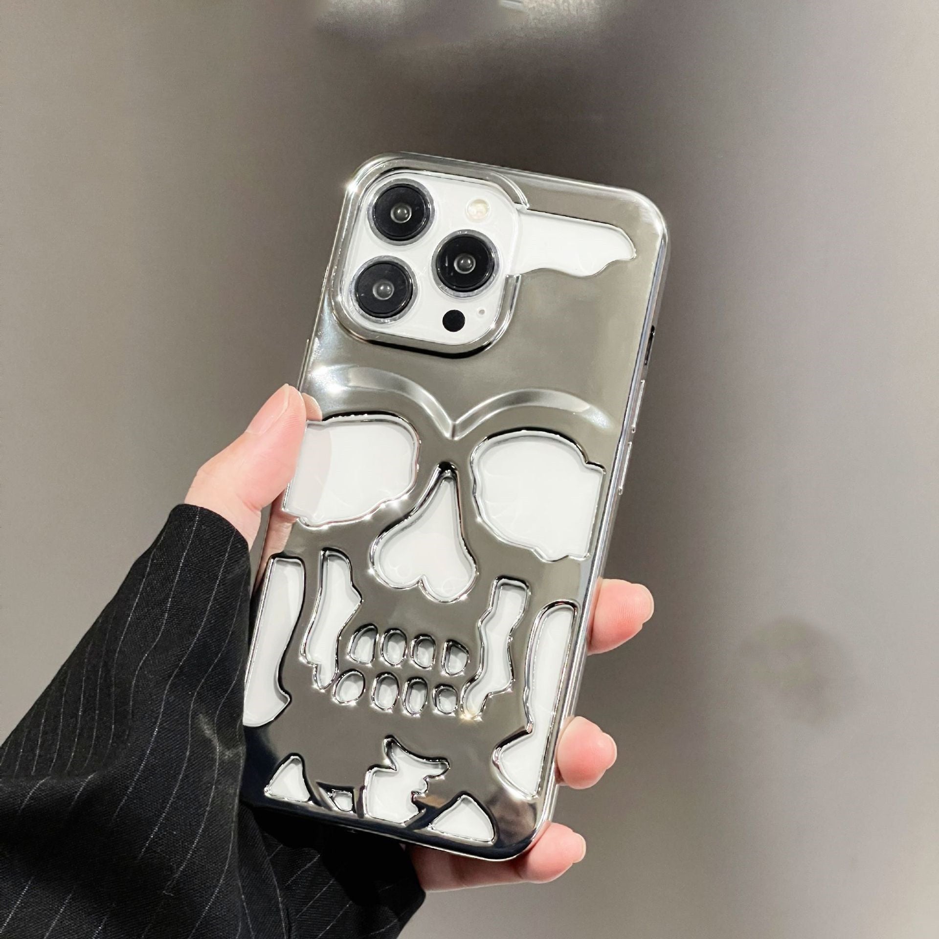 3D skull phone case with a glossy finish showcasing a bold skull design on a smartphone