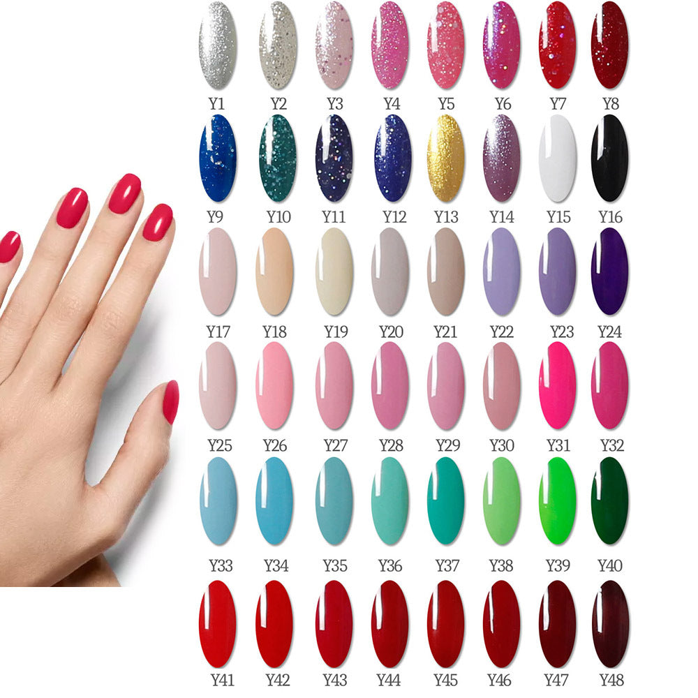 Variety of nail polish colors next to model's hand showcasing the 80W UV nail dryer for perfect nail finish