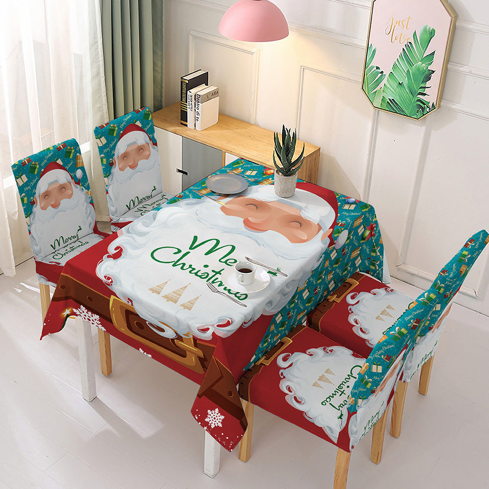 Christmas dining table decor featuring Santa Claus tablecloth and matching chair covers for festive gatherings