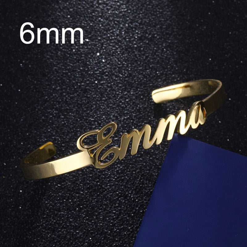 Gold custom name bracelet featuring the name Emma in stylish cursive lettering