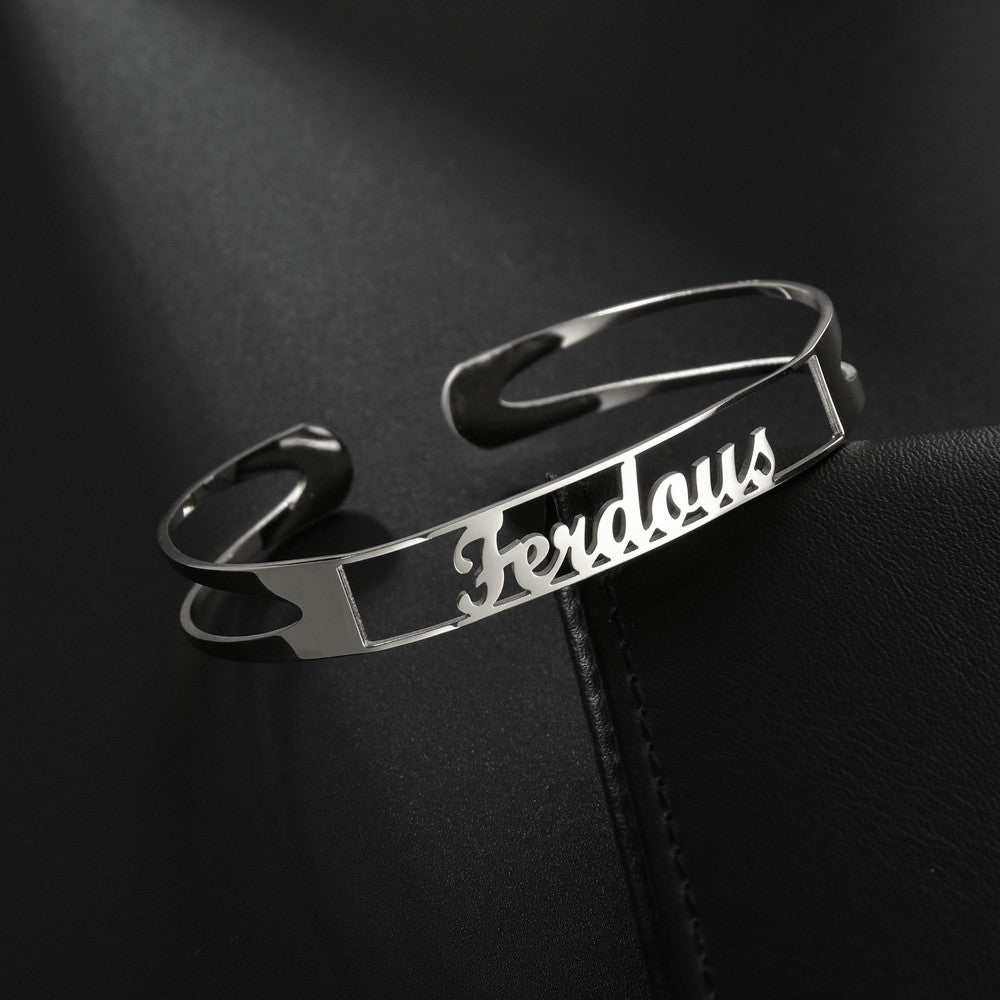 Personalized custom name bracelet in sleek metal design featuring the name Ferdous