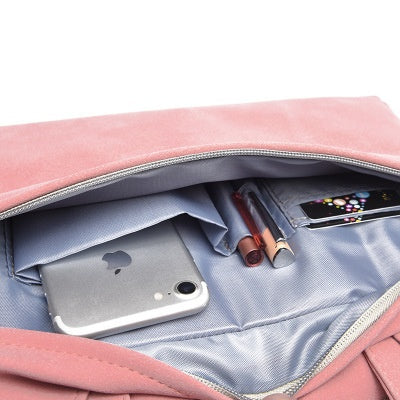 Spacious interior of a durable work bag for laptops featuring pockets for devices and essentials