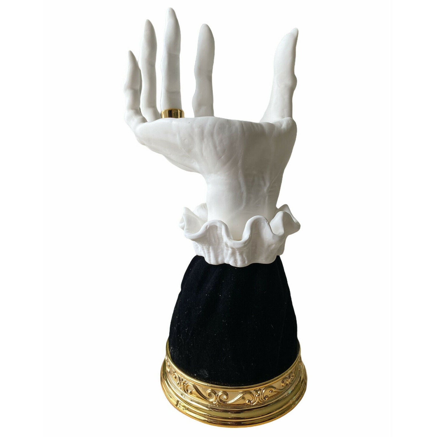 Halloween seat candlestick featuring a spooky skeletal hand design with gold accents