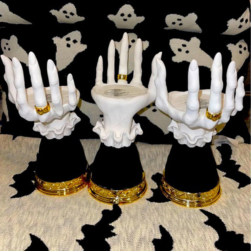 Unique Halloween seat candlestick featuring elegant white hands with gold accents for festive decor