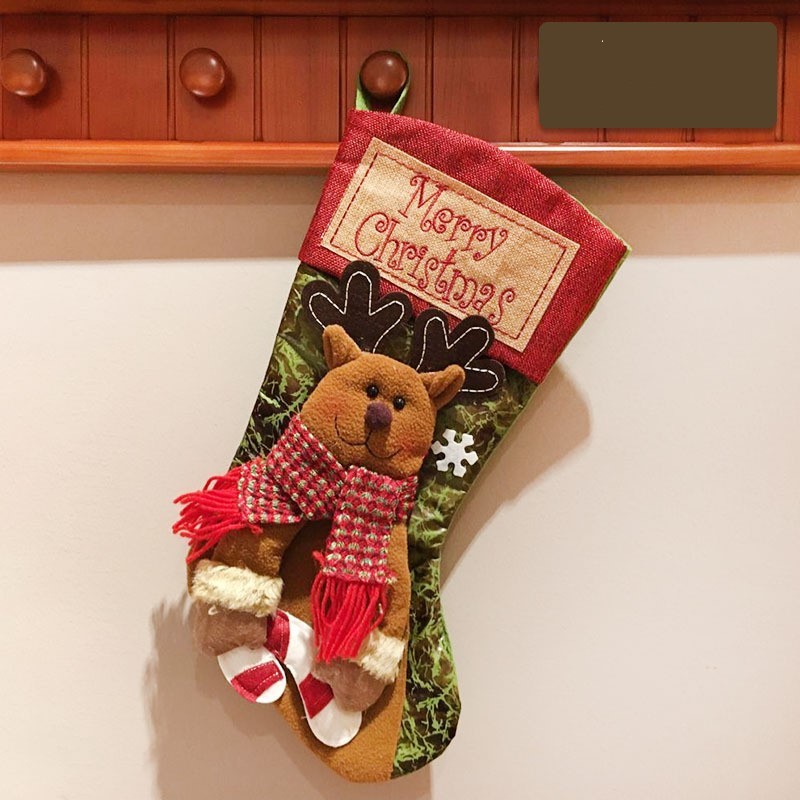 Festive Christmas stocking decorated with a reindeer and the words Merry Christmas
