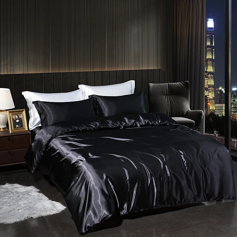 Luxury satin bedding set in black color, elegantly styled on a modern bed with city view at night