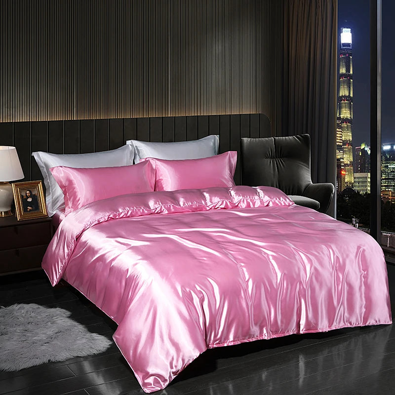 Luxury satin bedding set in pink color, featuring a smooth finish for an elegant bedroom look