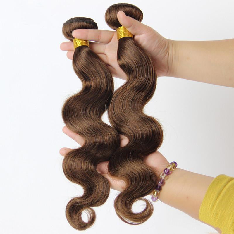 Real human hair extensions with wavy texture in a rich brown shade, held in hand for styling options