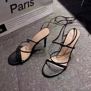 Black round toe stiletto heels with straps, perfect for women's fashion outfits and elegant occasions