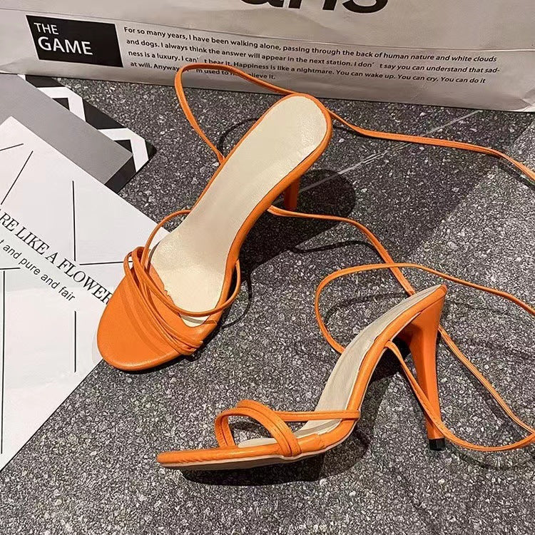 Stylish orange round toe stiletto heels with elegant strap design for women
