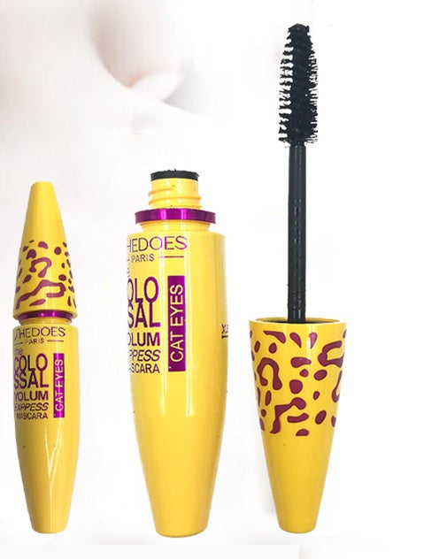 Gorgeous yellow tube of volumizing waterproof mascara for thick lashes with brush applicator for bold eye makeup