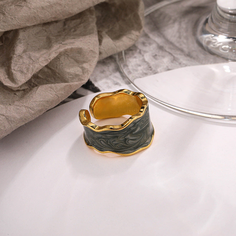 Unique sterling silver ring with a gold finish and wavy design for stylish accessories