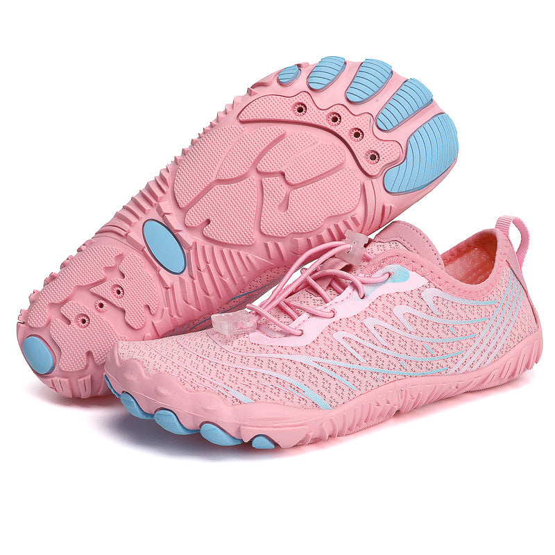 Light pink trekking non-slip shoes with breathable mesh uppers and rugged soles for outdoor adventures