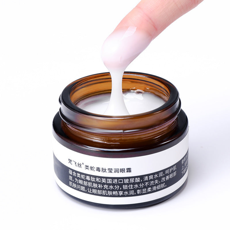 Youbuyforme firming eye cream in a brown jar, shown with a finger applying the product