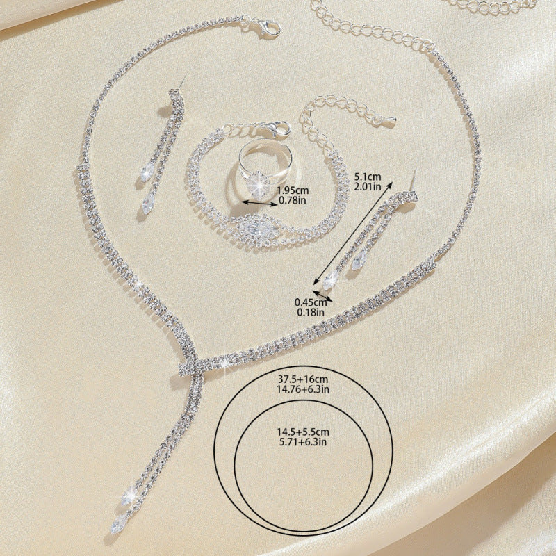 Elegant wedding zirconium jewelry set featuring a necklace, bracelet, ring, and earrings for brides