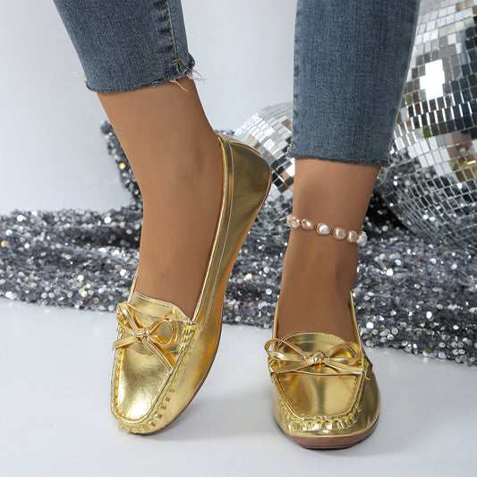 Stylish gold comfortable loafers for women with bow detail, perfect for casual outings
